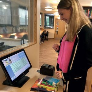 Library visitor using the Ruby Self-service kiosk
